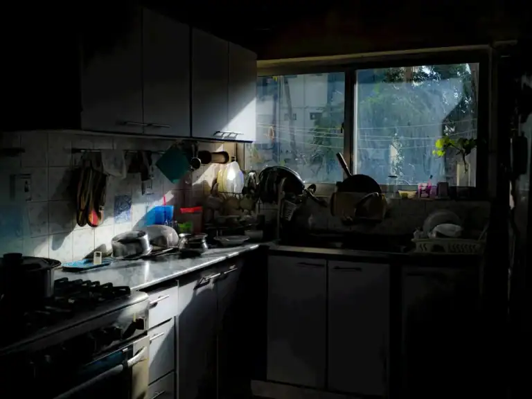 Sunlight streaming through a kitchen window into a home space